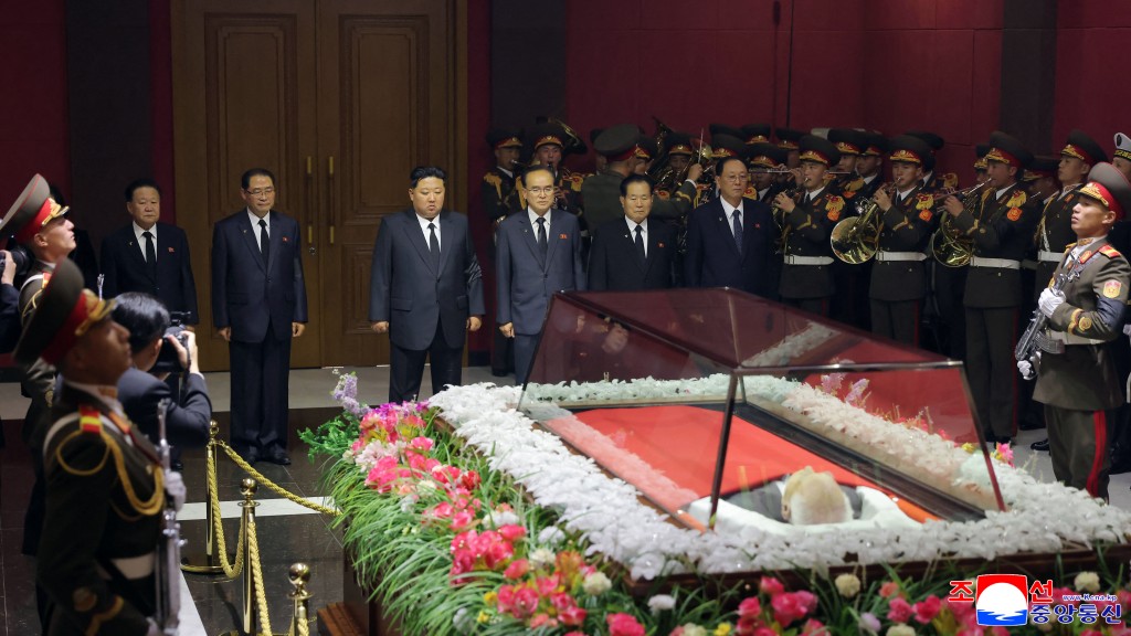 Photo by STR / KCNA VIA KNS / AFP  This picture taken and released by North Korea's official Korean Central News Agency (KCNA) on November 4, 2025 shows North Korean leader Kim Jong Un (3rd L) visiting the coffin of Kim Yong Nam to offer his condolences at an undisclosed location in North Korea.