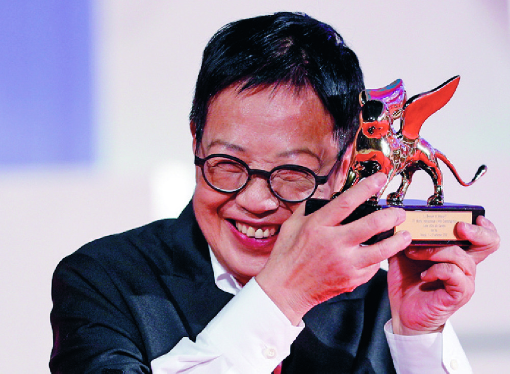 Hong Kong director Ann Hui holds her Golden Lion presented at the Venice Film Festival. Reuters Hong Kong director Ann Hui holds her Golden Lion presented at the Venice Film Festival. Reuters