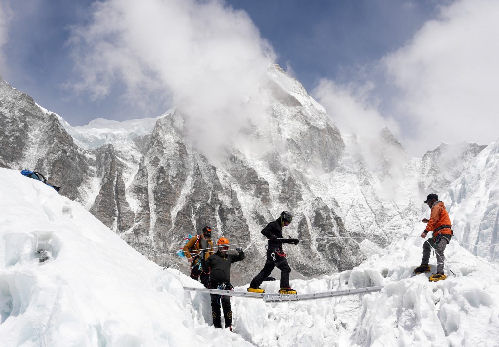 Mountaineers practice walking on a ladder during a training session at Everest base camp, Nepal April 15, 2025. (Reuters)