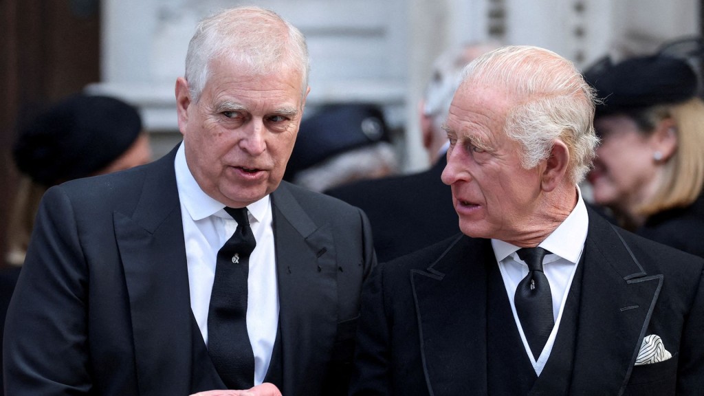 FILE PHOTO: Britain's Prince Andrew speaks with King Charles. Reuters