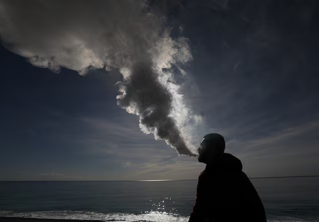 A man vapes on the beach in Nice, France. (AFP) A man vapes on the beach in Nice, France. (AFP)