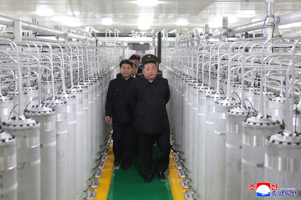 This picture taken on June 3, 2026 and released by North Korea's official Korean Central News Agency (KCNA) on June 4, 2026 shows North Korean leader Kim Jong Un (front R) inspecting the newly-inaugurated nuclear materials production factory at an undisclosed location in North Korea. (Photo by KCNA VIA KNS / AFP)