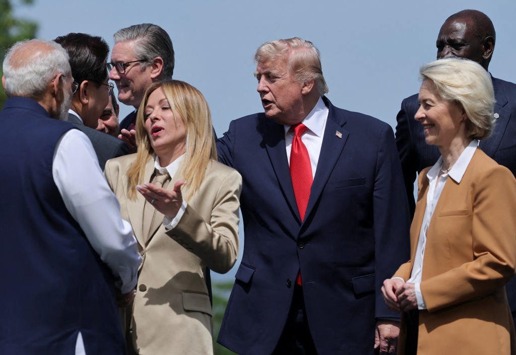 U.S. President Donald Trump, Italian Prime Minister Giorgia Meloni attend a family photo session during the G7 summit, in Evian-les-Bains, France, June 16 (Reuters)