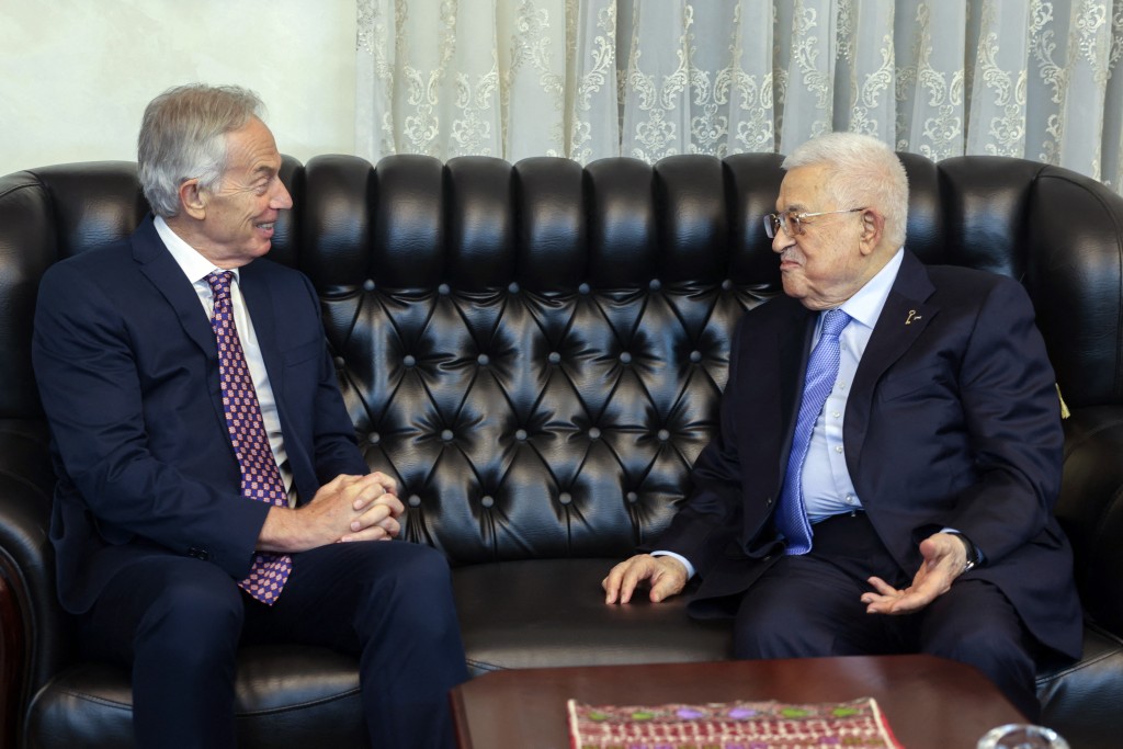 This handout picture released by the Palestinian Authority's press office (PPO) shows President Mahmud Abbas (R) meeting with Britain's former prime minister Tony Blair in Amman on July 13, 2025. Britain's government Monday, September 29, threw its weight behind US President Donald Trump's new plan to end the war in Gaza after it was presented to Israel and Palestinian militant group Hamas. (Photo by Thaer GHANAIM / PPO / AFP)