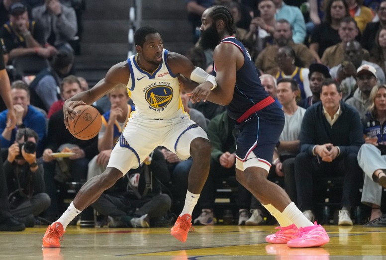 Golden State Warriors forward Jonathan Kuminga, left, tries to get past Los Angeles Clippers guard James Harden. AP