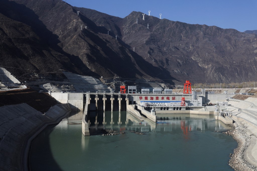 A hydroelectric dam is pictured from a high speed train, during a government-organized tour, near Shannan, Tibet Autonomous Region, China, March 30, 2025. REUTERS