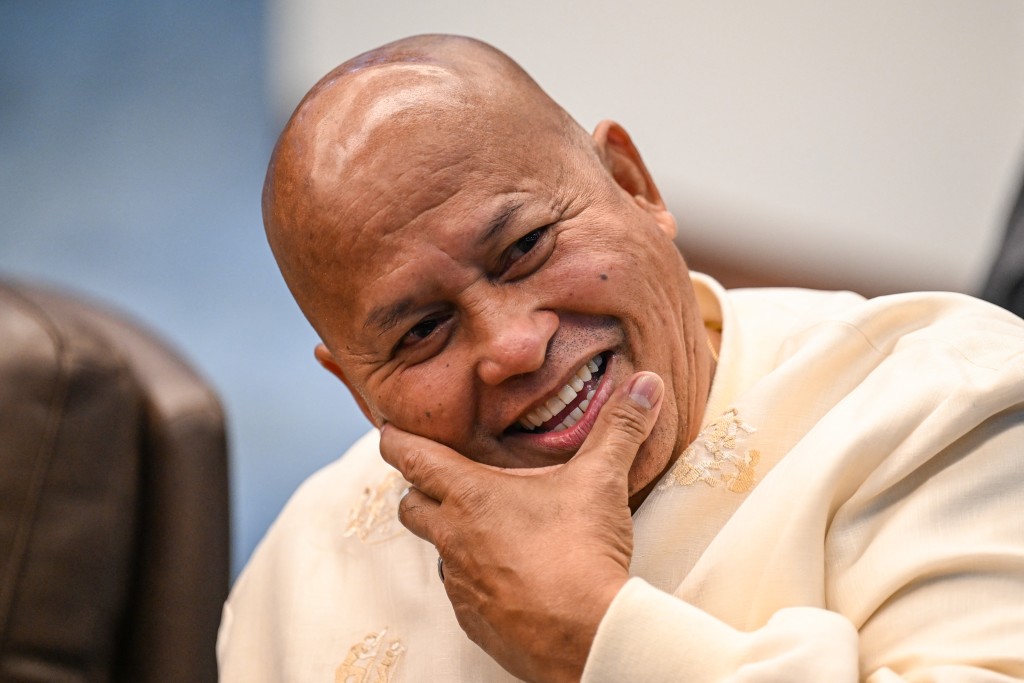 Photo by JAM STA ROSA / AFP Philippine Senator Ronald Dela Rosa reacts as he talks to the media before the start of a plenary session at the Senate of the Philippines in Pasay, Metro Manila on May 12, 2026.