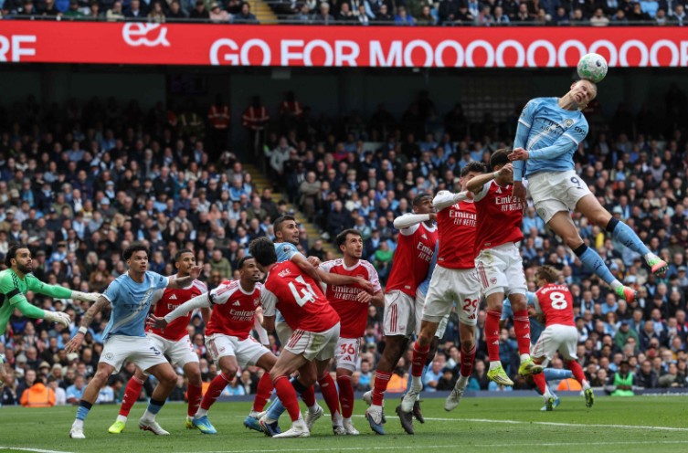 City strike Erling Haaland heads the ball in front of goal during the match against Arsenal at the Etihad Stadium. AFP 