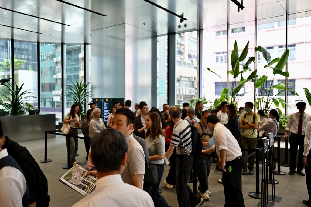 People lines up to buy during the second round of sales for The Pavilia Farm III.