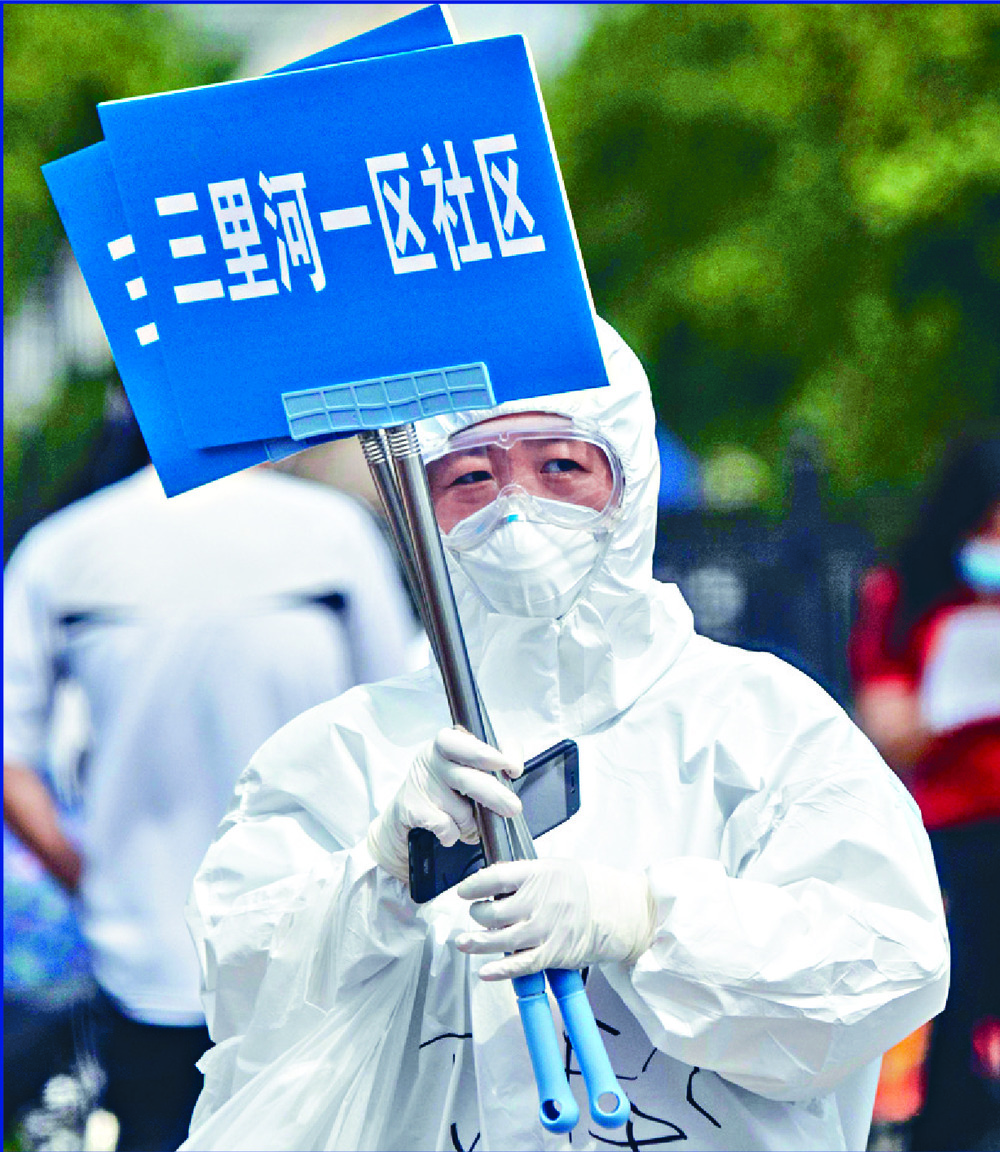 Medics assist people getting tests near Xinfadi as airline staff redirect some passengers at Beijing's main aiport. AFP, AP Medics assist people getting tests near Xinfadi as airline staff redirect some passengers at Beijing's main aiport. AFP, AP