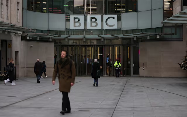 People walk outside the BBC Broadcasting House, after U.S. President Donald Trump sued the BBC for up to $10 billion in damages over edited clips of a speech, in London, Britain, December 16, 2025. REUTERS/Hiba Kola 