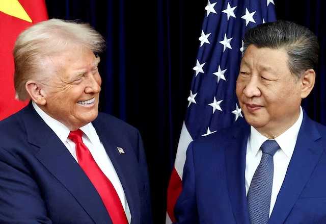 U.S. President Donald Trump and Chinese President Xi Jinping react as they hold a bilateral meeting at Gimhae International Airport, on the sidelines of the Asia-Pacific Economic Cooperation (APEC) summit, in Busan, South Korea, October 30, 2025. REUTERS/Evelyn Hockstein/File Photo 