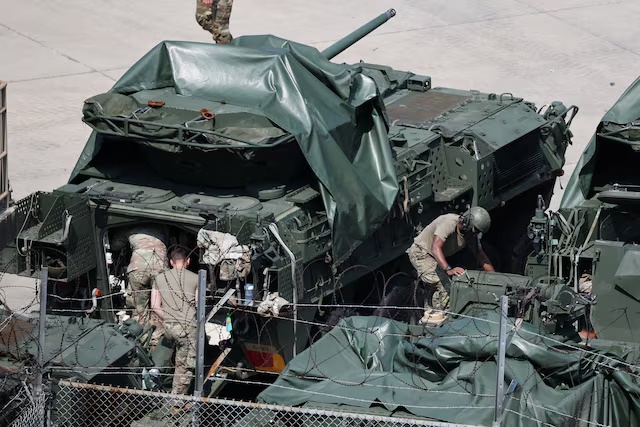 U.S. Army soldiers work on their armed vehicles at a U.S. army base near the demilitarized zone separating two Koreas, in Dongducheon, South Korea, August 18, 2026. REUTERS/Kim Hong-Ji