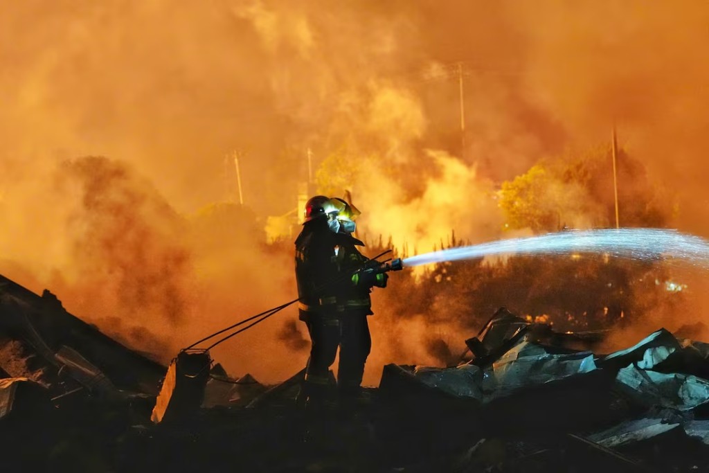 Firefighters work to distinguish a fire following a blast at a fireworks manufacturing factory in Liuyang, Hunan province, China, May 5, 2026. cnsphoto via REUTERS