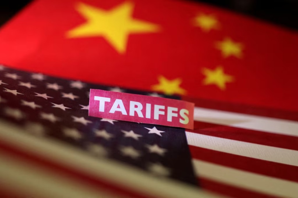 U.S. and Chinese flags and a "tariffs" label are seen in this illustration created on April 10, 2025. REUTERS/Dado Ruvic/Illustration/File Photo