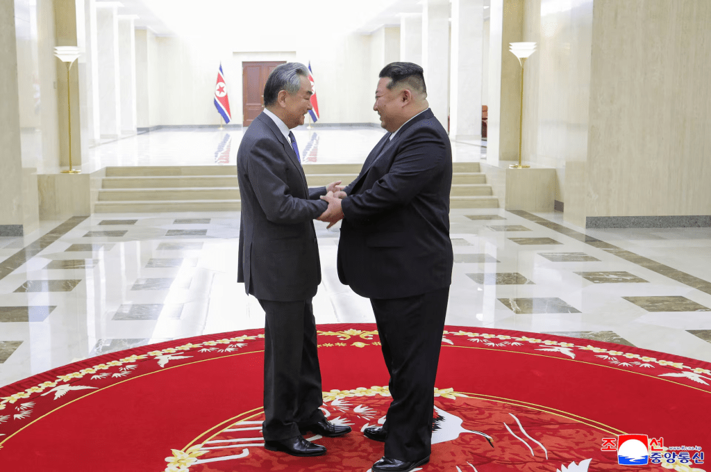 North Korean leader Kim Jong Un shakes hands with China's Foreign Minister Wang Yi as they meet in Pyongyang, North Korea, April 10, 2026, in this picture released by North Korea's official Korean Central News Agency. KCNA via REUTERS 