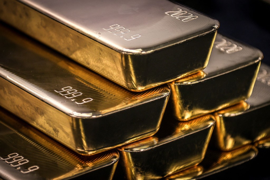 Gold bullion bars are pictured after being inspected and polished at the ABC Refinery in Sydney on August 5, 2020. AFP
