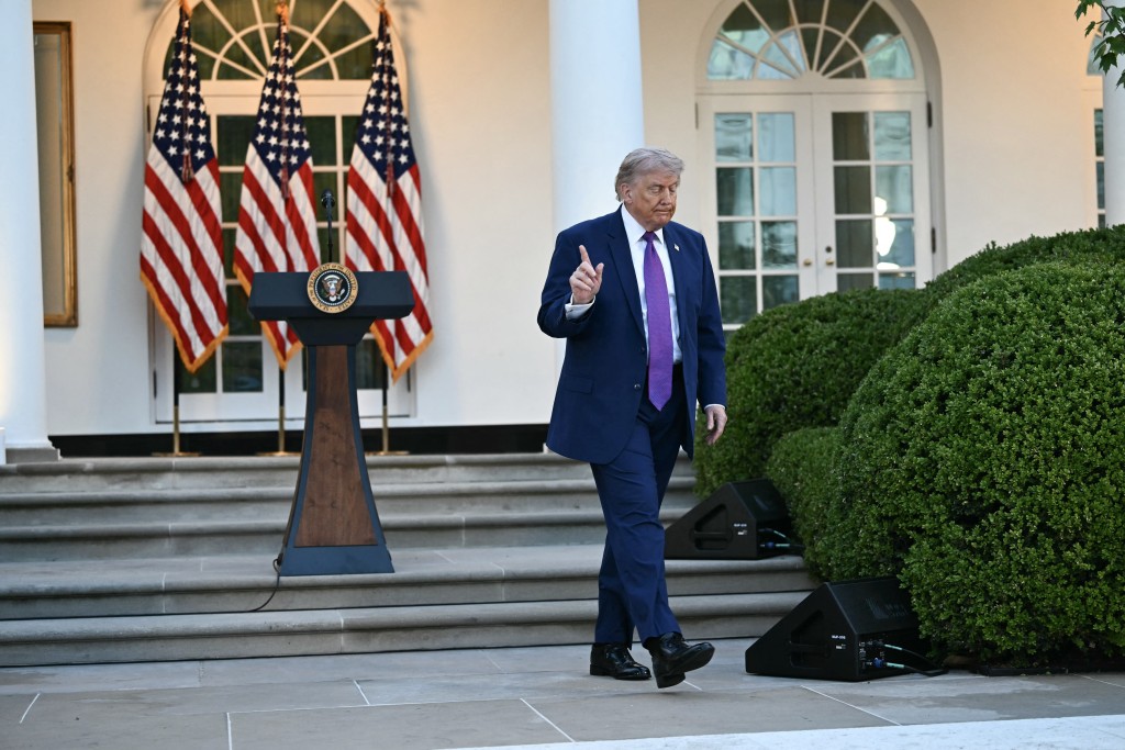 US President Donald Trump walks from the podium during a "Rose Garden Club" dinner in honor of Police Week at the White House in Washington, DC, on May 11, 2026. (Photo by Kent NISHIMURA / AFP)
