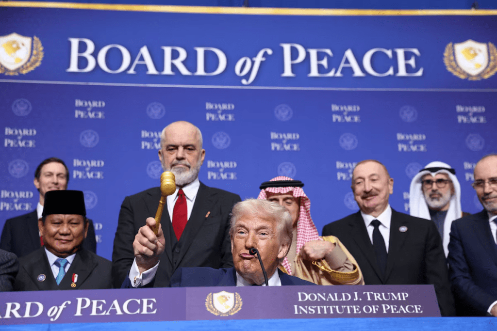 U.S President Donald Trump holds a gavel, during the inaugural Board of Peace meeting at the U.S. Institute of Peace in Washington, D.C., U.S., February 19, 2026. REUTERS/Kevin Lamarque 