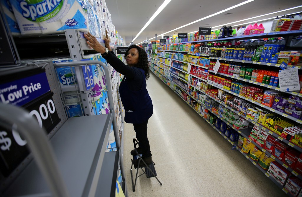  Mamie Penn works sorting shelving displays as workers prepare for the opening of a Walmart Super Center in  Compton, California, U.S., January 10, 2017.  REUTERS/Mike Blake/File Photo
