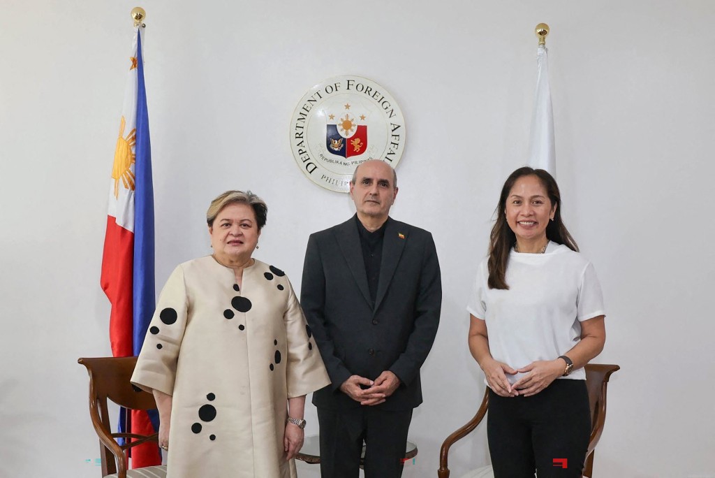 Photo by HANDOUT / PHILIPPINE DEPARTMENT OF FOREIGN AFFAIRS / AFP  In this handout photo taken April 1, 2026 and released by the Philippine Department of Foreign Affairs shows Philippine Secretary of Foreign Affairs Thereza Lazaro (L), Iranian Ambassador to the Philippines Yousef Esmaeilzadeh (C) and Philippine Secretary of Energy Sharon Garin posing for a photo during a bilateral meeting in Manila.