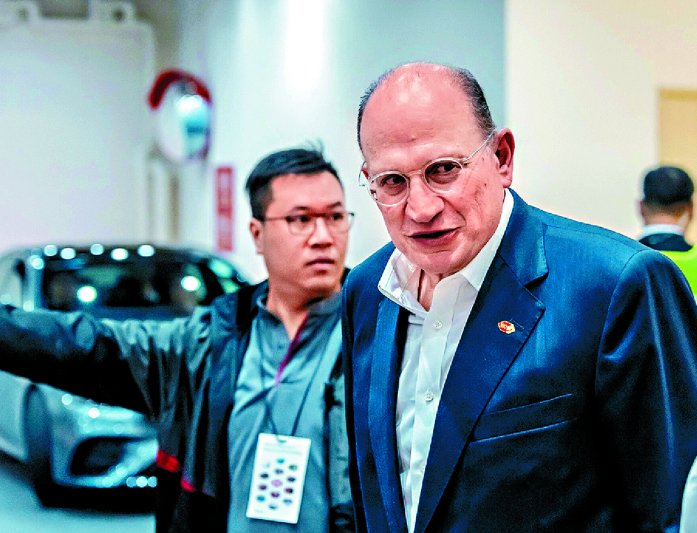 Mark Tucker leaves following the informal shareholders meeting in Hong Kong. BLOOMBERG Mark Tucker leaves following the informal shareholders meeting in Hong Kong. BLOOMBERG