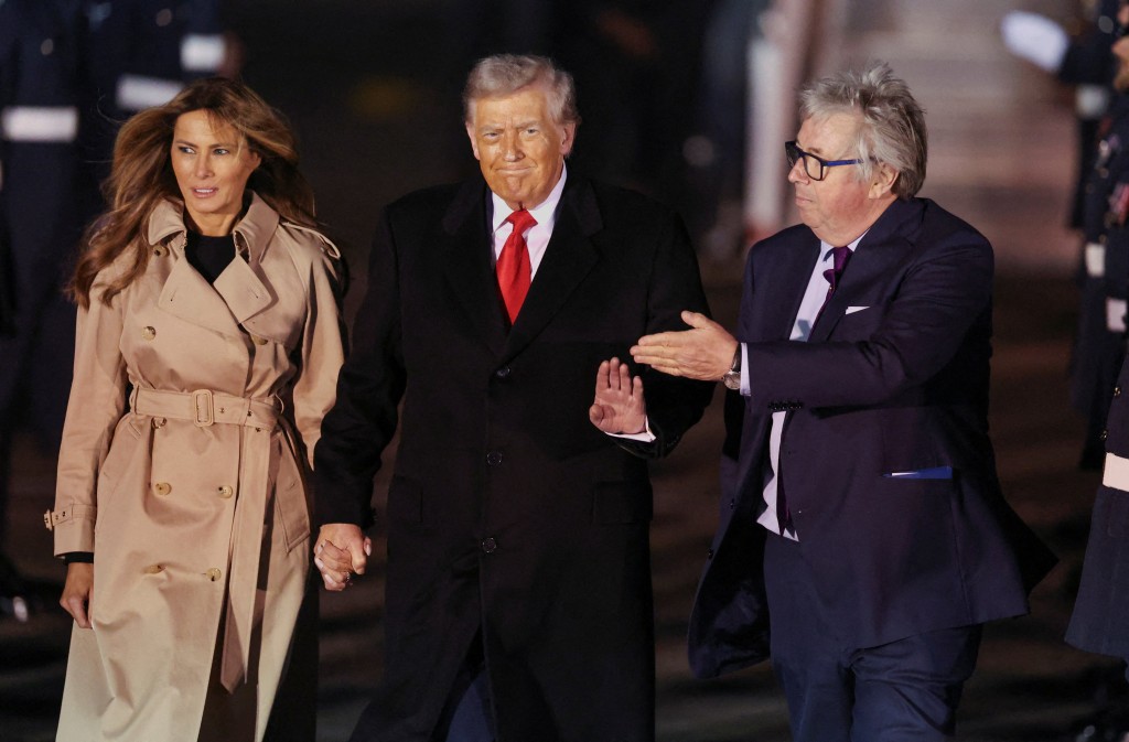 US President Donald Trump and first lady Melania Trump are greeted by Viscount Henry Hood, representing Britain's King Charles, as they arrive for their state visit to Britain, at London Stansted Airport near London, Britain, September 16, 2025. REUTERS/Chris Radburn