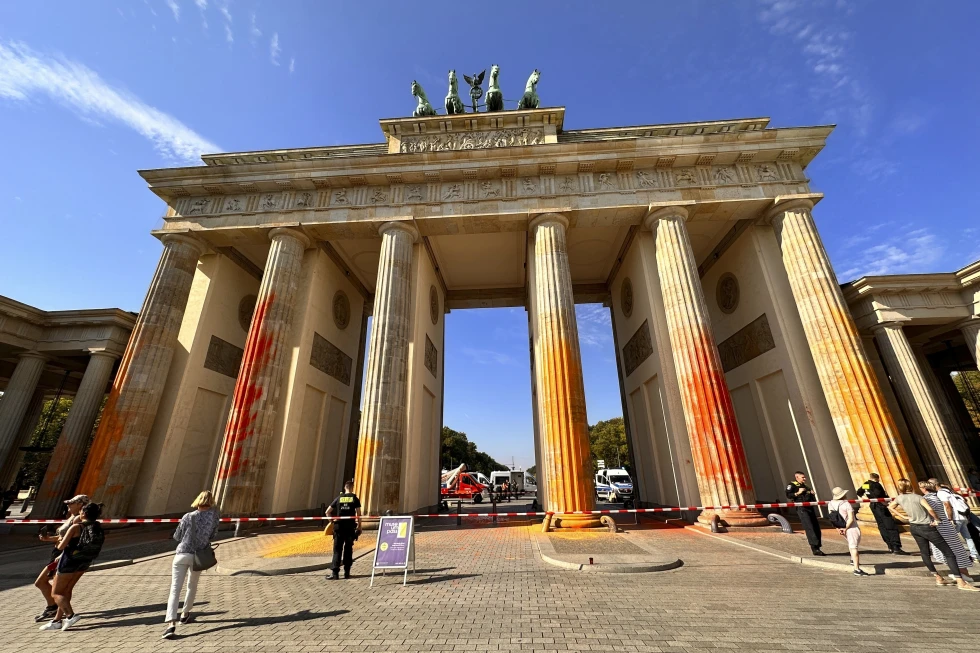 Members of the climate protection group Last Generation have sprayed the Brandenburg Gate with orange paint in Berlin, Germany, Sunday, Sept. 17, 2023. (AP) Members of the climate protection group Last Generation have sprayed the Brandenburg Gate with orange paint in Berlin, Germany, Sunday, Sept. 17, 2023. (AP)
