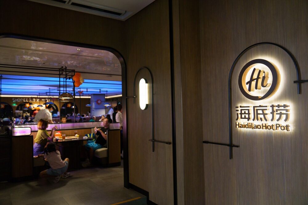 Signage at a Haidilao International Holding Ltd. hotpot restaurant in Singapore, Singapore, on Saturday, Sept. 7, 2024. Chinese hot pot chain Haidilao said it will focus on expanding further into established foreign markets in the coming years, notably the US, working to draw new customers as diners at home pull back on spending. © Photographer: Ore Huiying/Bloomberg
