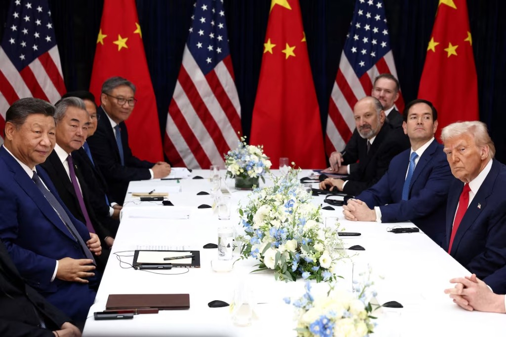 U.S. President Donald Trump, accompanied by U.S. Secretary of State Marco Rubio and U.S. Secretary of Commerce Howard Lutnick, attends a bilateral meeting with Chinese President Xi Jinping, accompanied by Chinese Foreign Minister Wang Yi, at Gimhae International Airport, on the sidelines of the Asia-Pacific Economic Cooperation (APEC) summit, in Busan, South Korea, October 30, 2025. REUTERS/Evelyn Hockstein