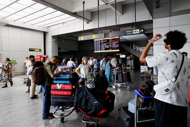 Passengers wait at Terminal 2 of Indira Gandhi International Airport in New Delhi, India, July 1, 2024. REUTERS/Anushree Fadnavis