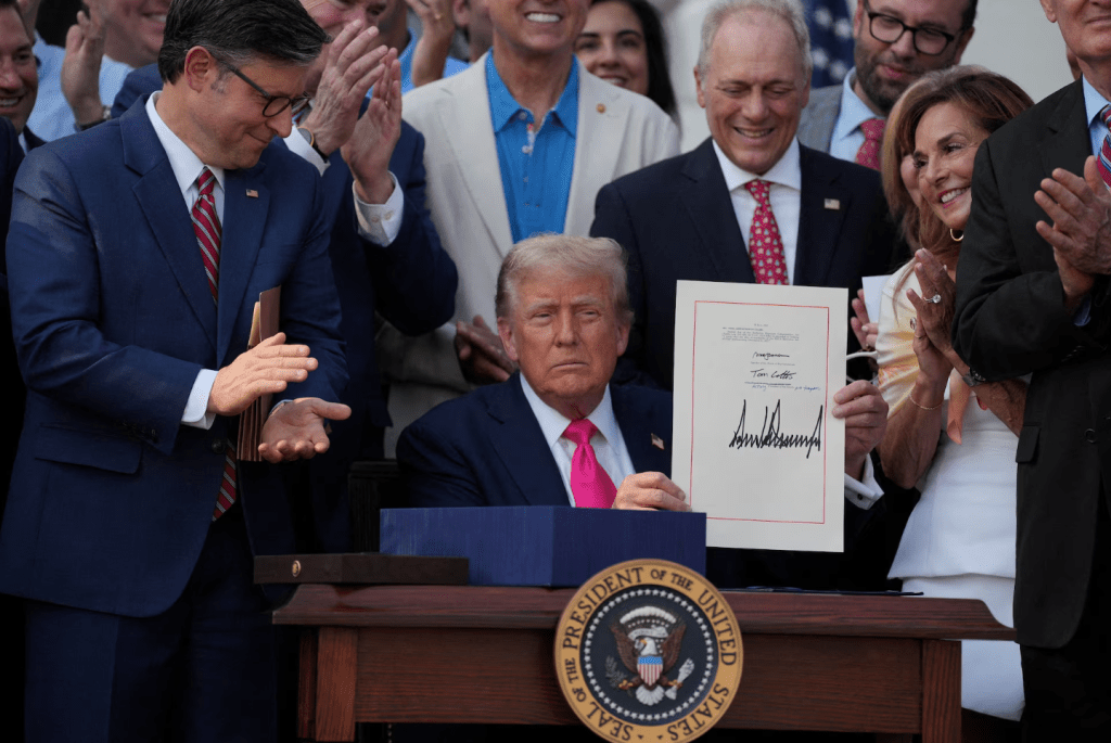 U.S. President Donald Trump presents a sweeping spending and tax legislation, known as the "One Big Beautiful Bill Act," after he signed it, at the White House in Washington, D.C., U.S., July 4, 2025. (REUTERS/Leah Millis)