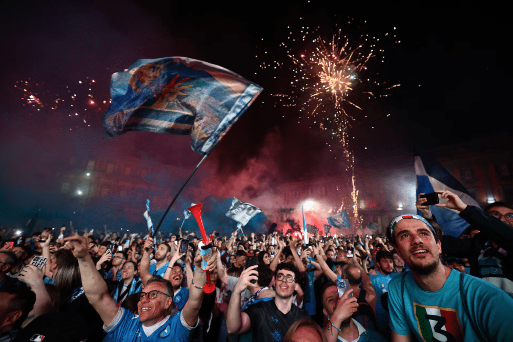 Napoli fans celebrates as they watch the match in the Piazza del Plebiscito in Naples. (REUTERS/Yara Nardi)