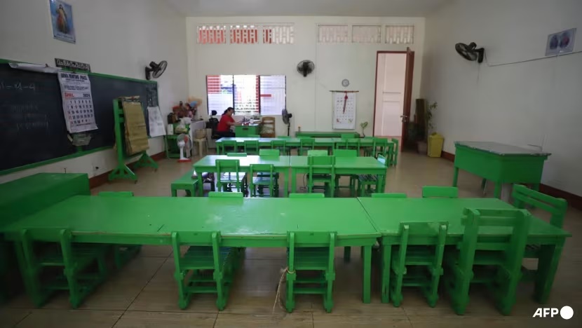 A teacher (background) works inside an empty classroom after in-person classes were suspended due to dangerous levels of heat, at an elementary school in Iloilo City, central Philippines on Apr 2, 2024. (File photo: AFP/Arnold Almacen) A teacher (background) works inside an empty classroom after in-person classes were suspended due to dangerous levels of heat, at an elementary school in Iloilo City, central Philippines on Apr 2, 2024. (File photo: AFP/Arnold Almacen)