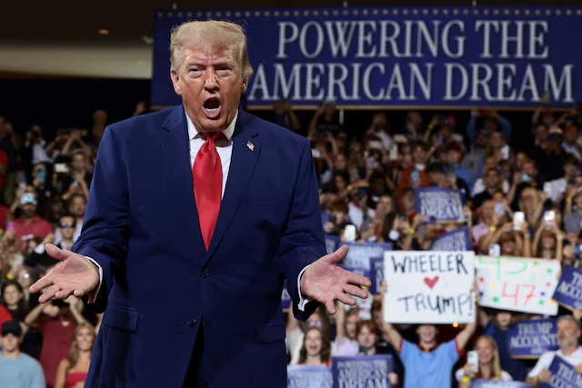U.S. President Donald Trump gestures as he delivers remarks on the "Trump Accounts" tax-advantaged investment program at Wheeler High School in Marietta, Georgia, U.S., July 22, 2026. REUTERS/Evelyn Hockstein