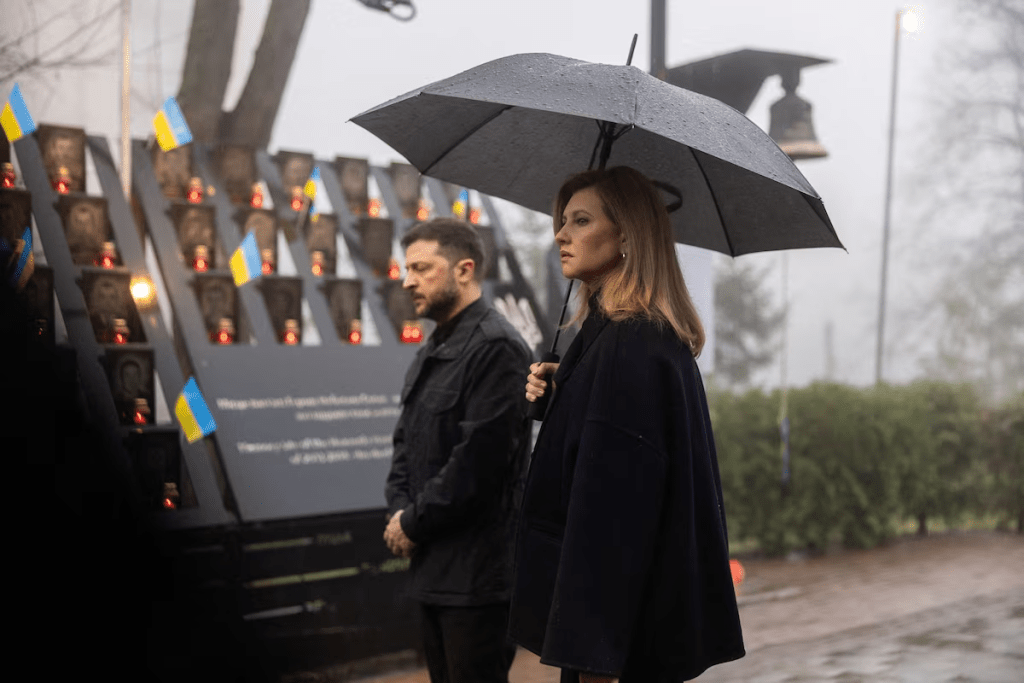 Ukraine's President Volodymyr Zelenskiy and his wife Olena attend a commemoration ceremony in Kyiv, Ukraine November 21, 2025. Ukrainian Presidential Press Service/Handout via REUTERS