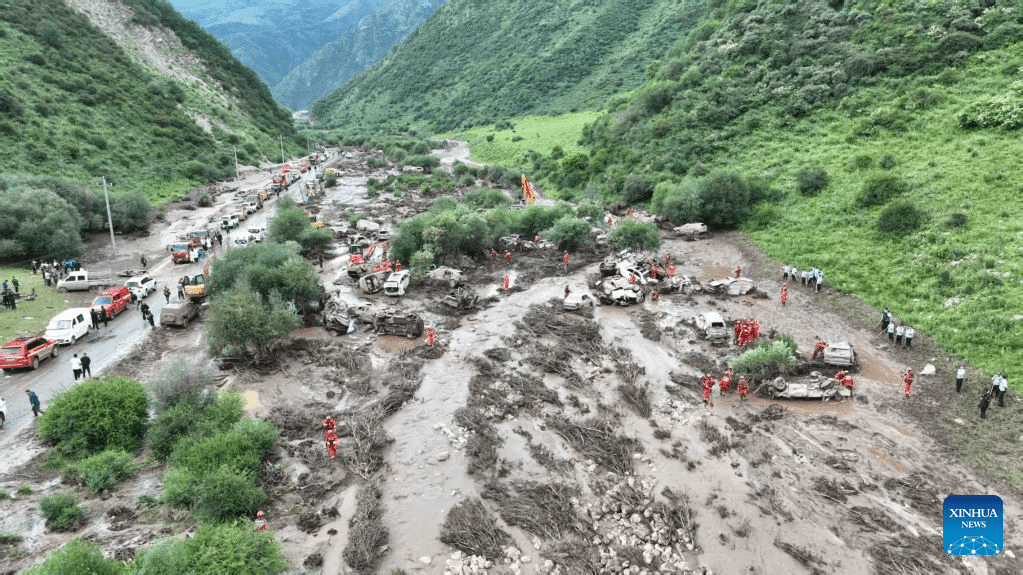 An aerial drone photo shows search-and-rescue operations underway at the flood-hit scenic area in Weiyuan County, northwest China's Gansu Province, July 26, 2026. (XINHUA)