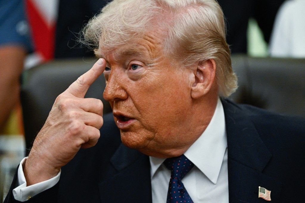 US President Donald Trump gestures as he speaks before signing a proclamation to revive the Presidential Fitness Test Award, a competitive school-based fitness program, in the Oval Office of the White House in Washington, DC on May 5, 2026. (AFP)