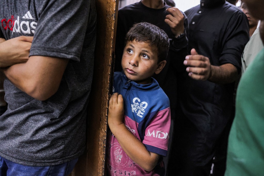 Photo by BASHAR TALEB / AFP  A boy looks on during a funeral for a Palestinian who was killed following a reported Israeli attack in the Mawasi area in Khan Yunis in the southern Gaza Strip on July 7, 2026.