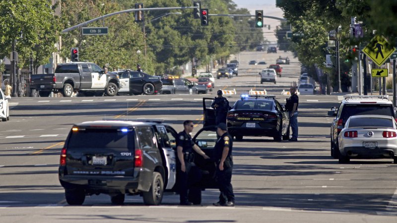 Law enforcers from several jurisdictions patrol Spring Street in downtown Paso Robles, California, as law enforcement agencies responded to an early morning shooting in the Central Coast city after a sheriff's deputy was wounded early Wednesday. Law enforcers from several jurisdictions patrol Spring Street in downtown Paso Robles, California, as law enforcement agencies responded to an early morning shooting in the Central Coast city after a sheriff's deputy was wounded early Wednesday.