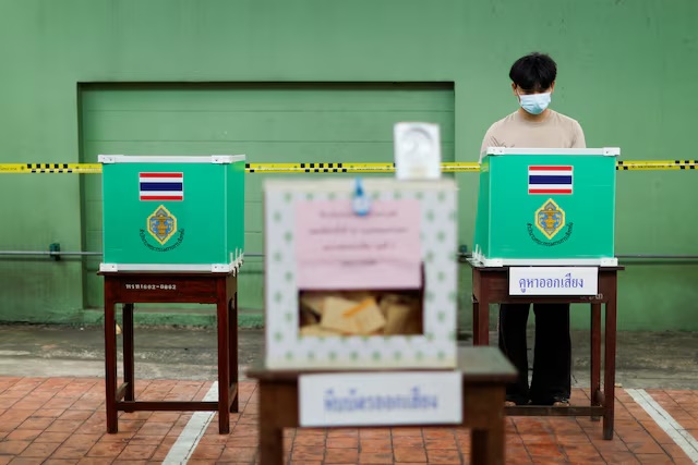 A person votes during the general elections at a polling station in Bangkok, Thailand, February 8, 2026. REUTERS/Patipat Janthong/File Photo