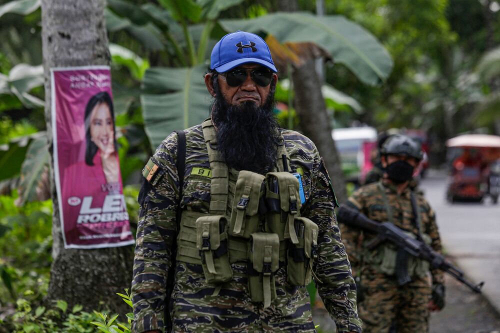 Moro Islamic Liberation Front (MILF) troops stand along a road inside Camp Darapanan in Sultan Kudarat, Maguindanao on April 23, 2022. (AFP) Moro Islamic Liberation Front (MILF) troops stand along a road inside Camp Darapanan in Sultan Kudarat, Maguindanao on April 23, 2022. (AFP)