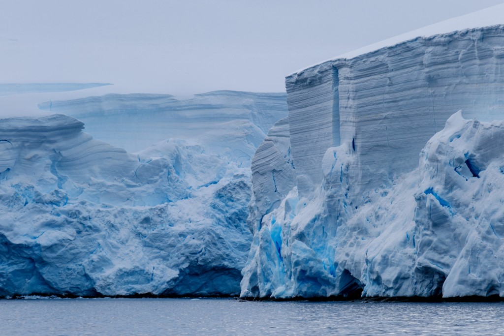 This handout picture released on August 20, 2025, by the University of Santiago USACH, shows a view of Antarctica during a study led by a team of Chilean scientists of the University of Santiago with researchers from the Netherlands and Germany, to determine the presence of heavy metals in Antarctica due to the increase in tourism in the area. (Photo by Jose Jorquera / University of Santiago USACH / AFP)