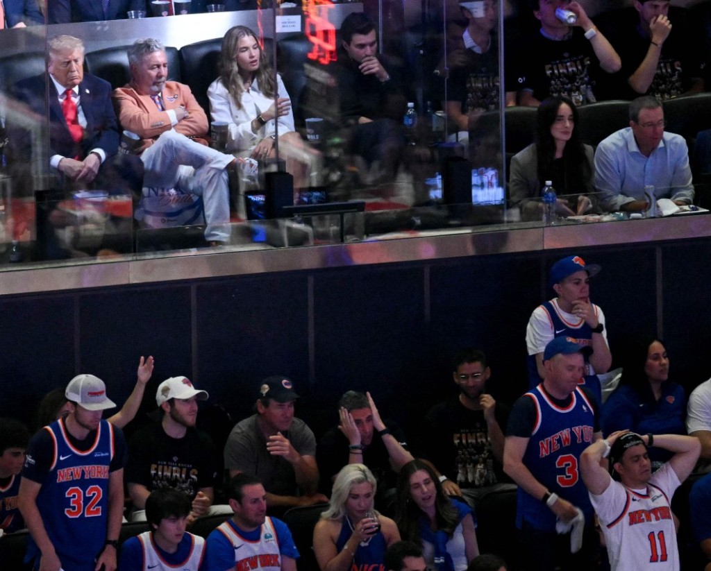 Donald Trump, top left, watches the game from an executive suite at Madison Square Garden. AFP