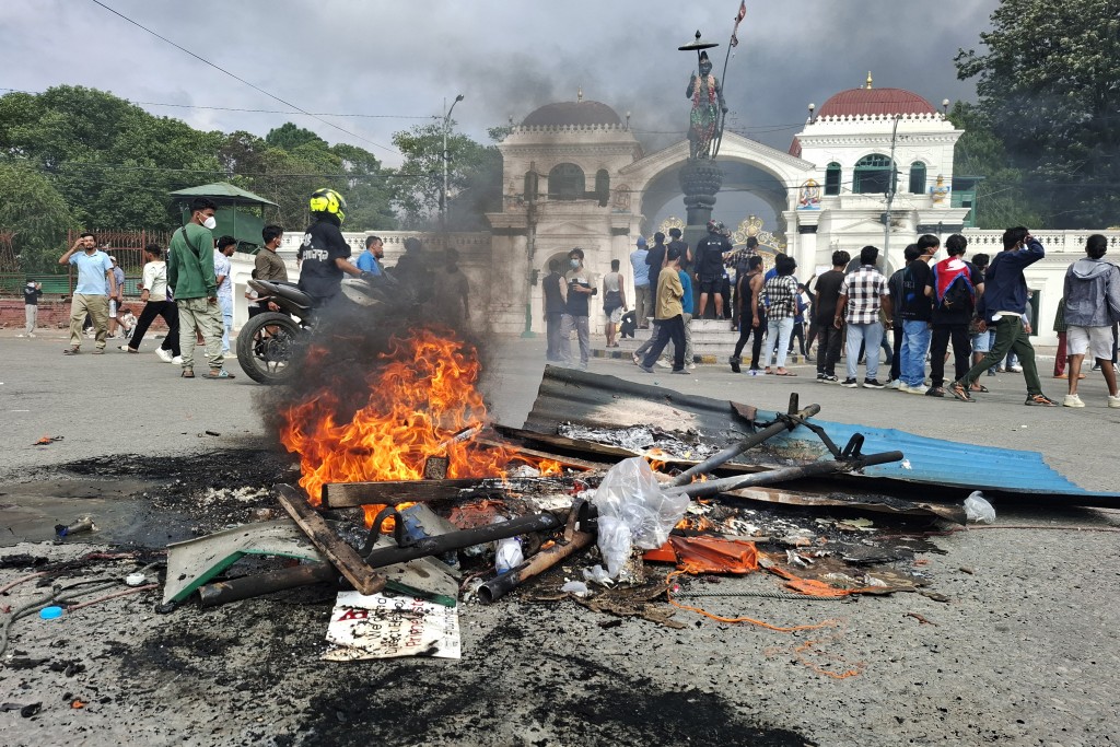 Items are set on fire by protesters during a protest to condemn the police's deadly crackdown on demonstrators in Kathmandu on September 9, 2025. (AFP)