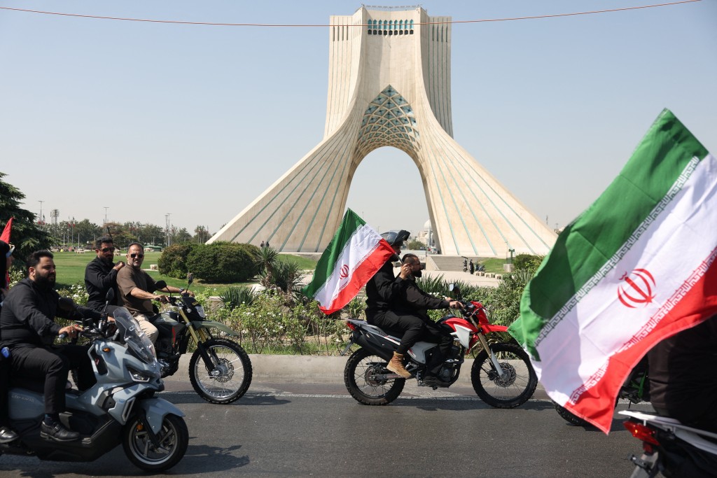 Members of Iranian militia forces (Basij) ride on motorcycles as they participate in a march in Tehran, Iran, September 25, 2026. Majid Asgaripour/WANA (West Asia News Agency) via REUTERS