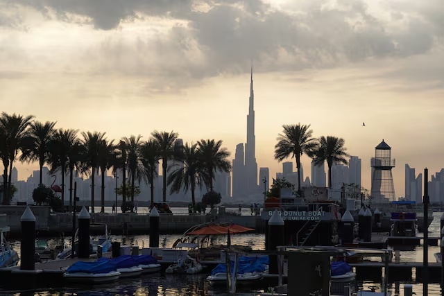 Boats are docked at Dubai Creek Harbour as the Dubai skyline, including the Burj Khalifa, is seen in the background in Dubai, United Arab Emirates, March 6, 2026. REUTERS/Amr Alfiky 