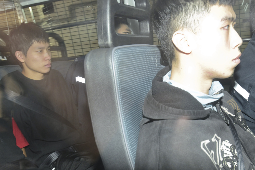 Jawin Mok, left, pleaded guilty to possessing nearly 140 petrol bombs. SING TAO Jawin Mok, left, pleaded guilty to possessing nearly 140 petrol bombs. SING TAO