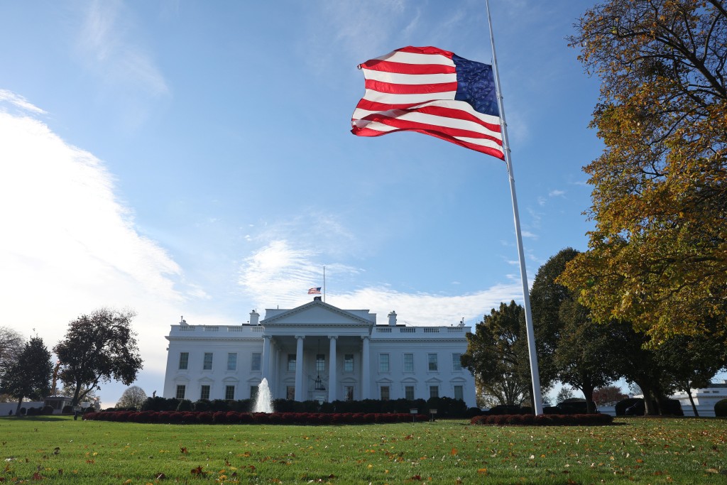 A large American flag flies on the north lawn of the White House in Washington, D.C., U.S. November 11, 2025.  REUTERS/Chris Helgren
