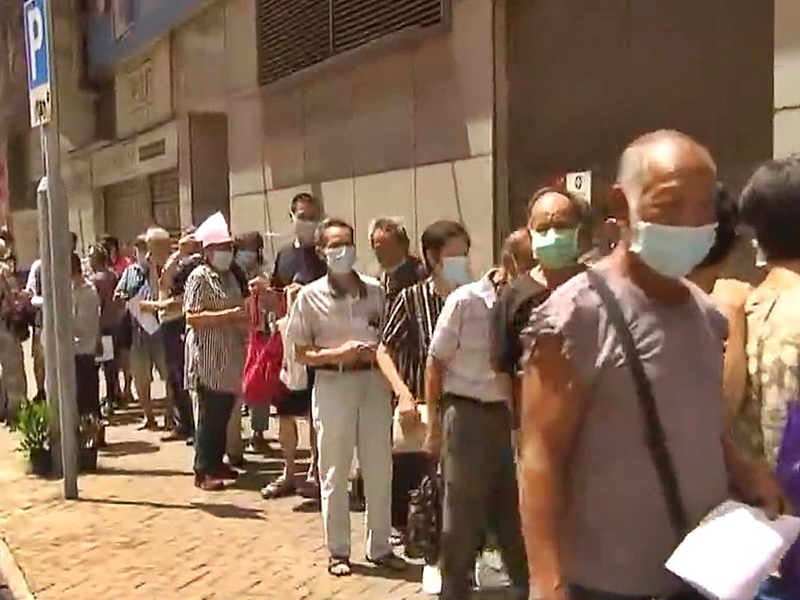 Hundreds queue up over consumption voucher problems as govt promises ...